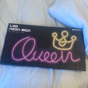led neon sign that says queen